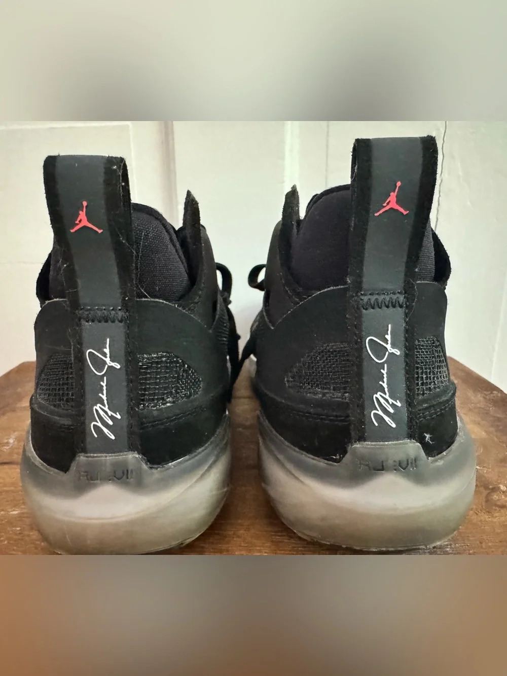 Boy’s Nike Air Jordan XXXVII Black Hot Punch basketball shoes.